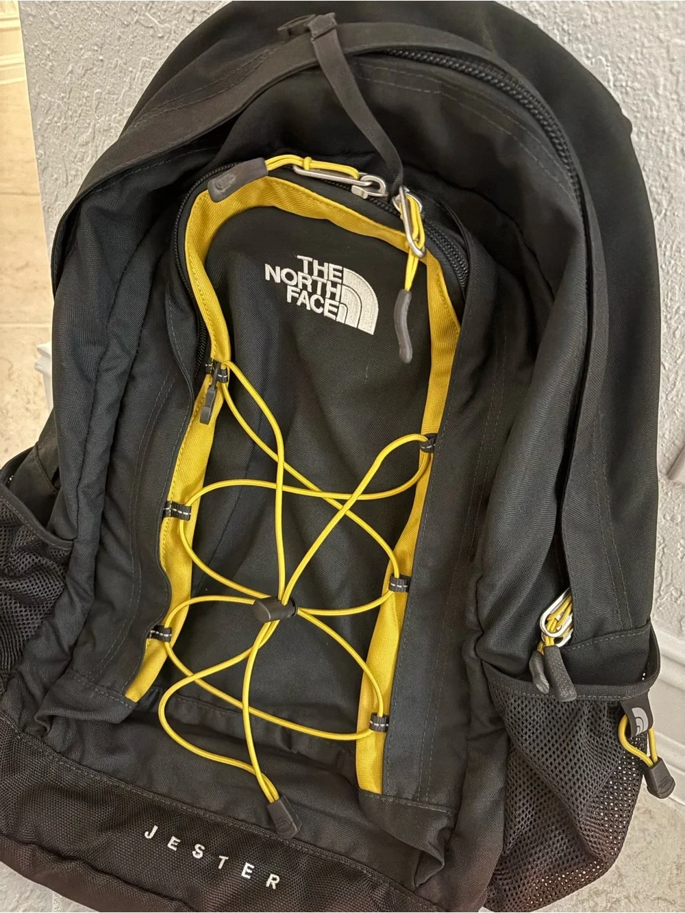 The North Face Navy and Gray Jester Backpack with Yellow Bungee Cord